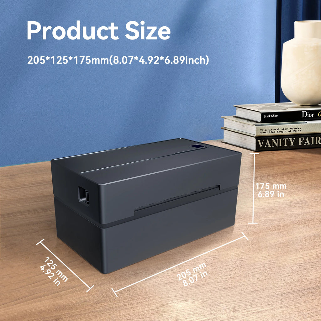 Black rectangular product with dimensions displayed on a wooden surface against a blue wall.