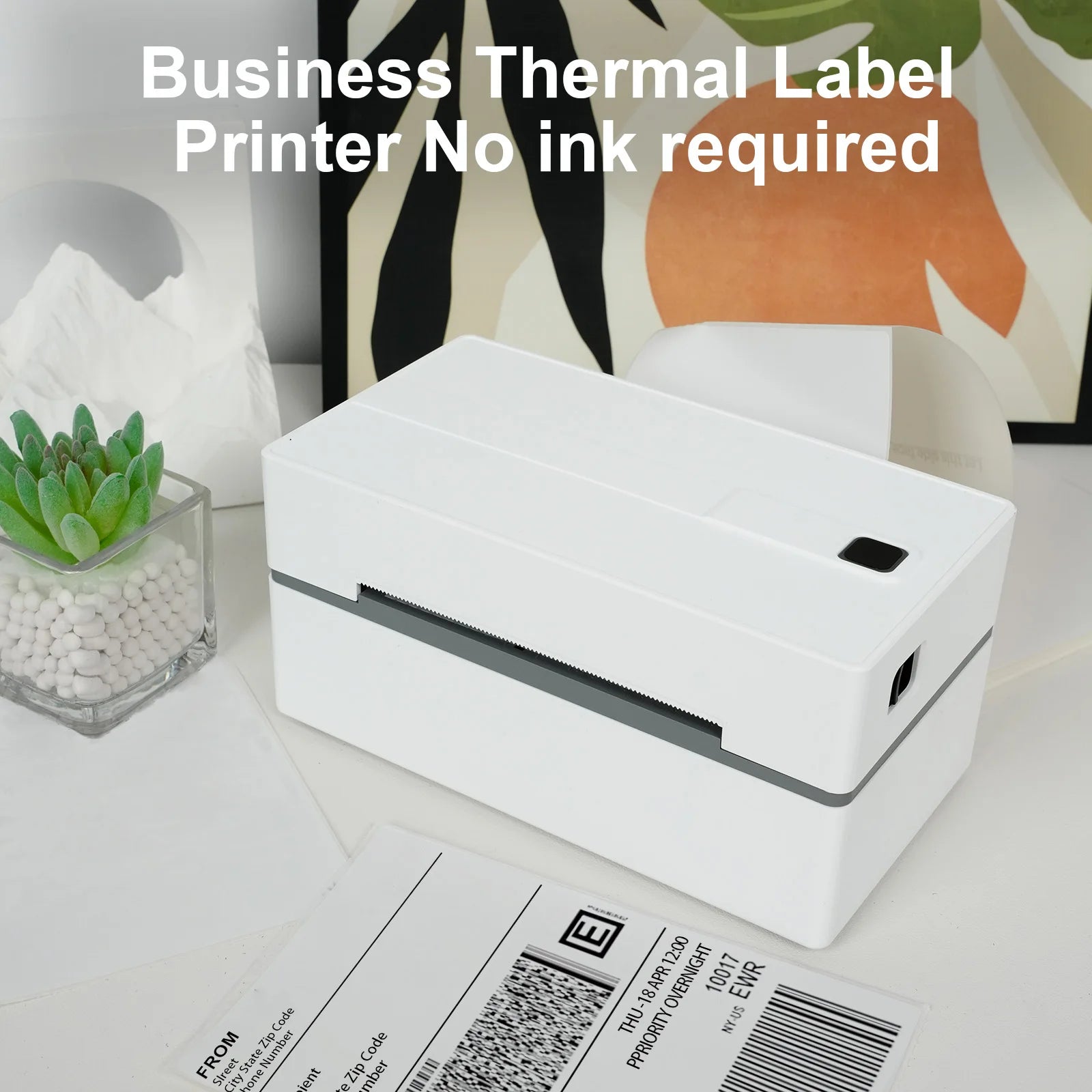 White thermal label printer on a desk with office supplies in the background