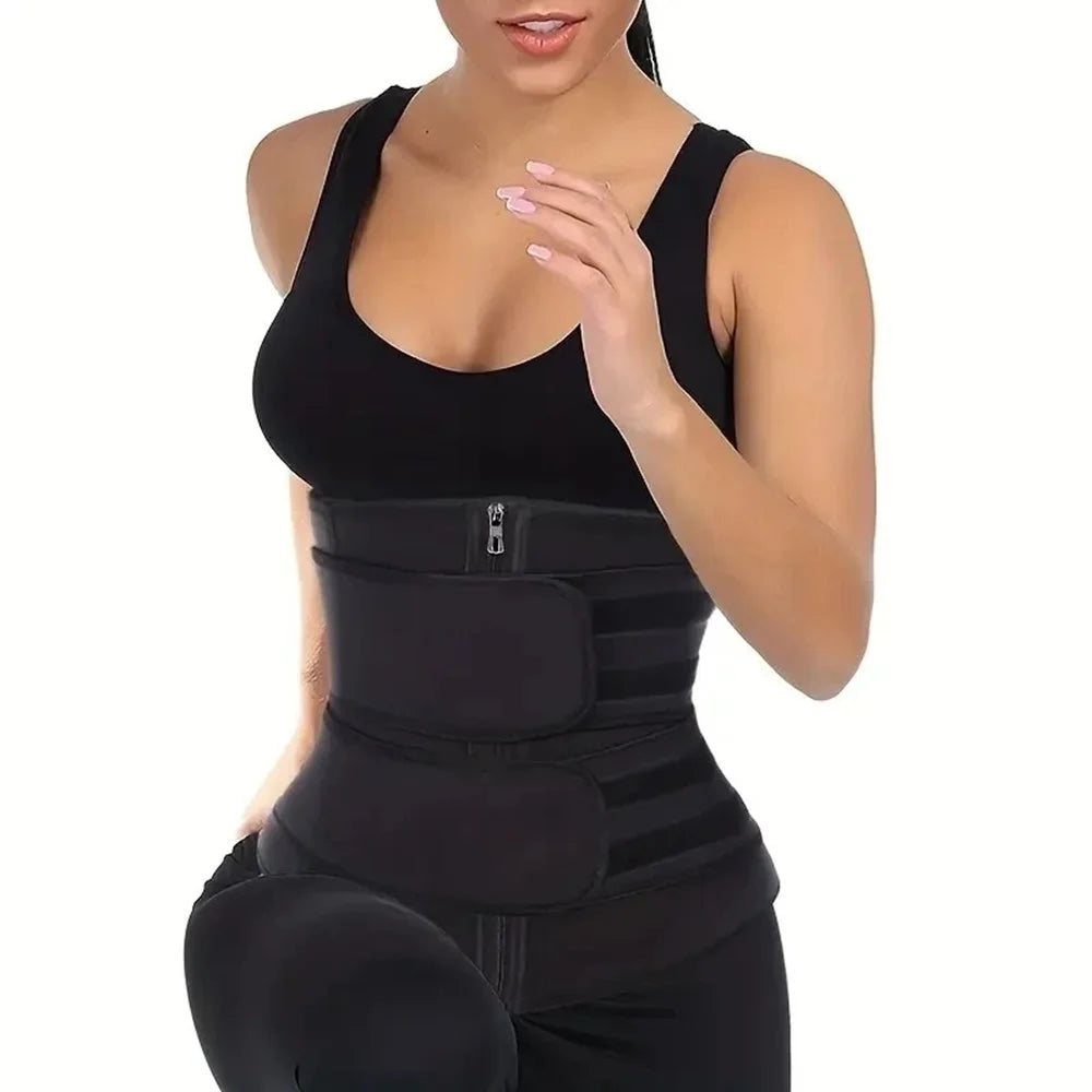 Person wearing a black waist trainer on a white background
