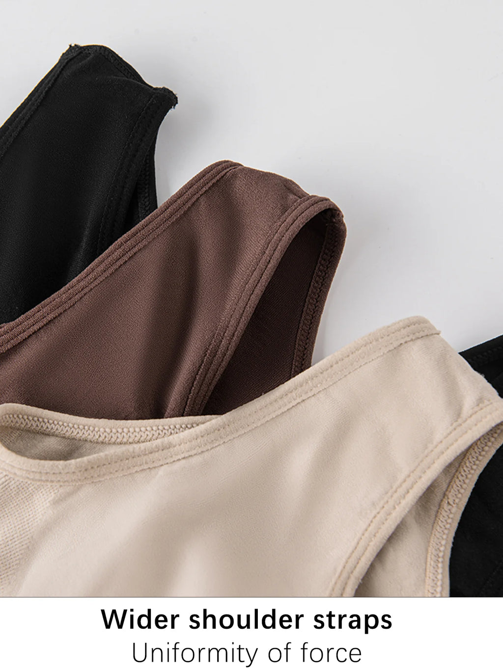 Close-up of wider shoulder straps on a white background