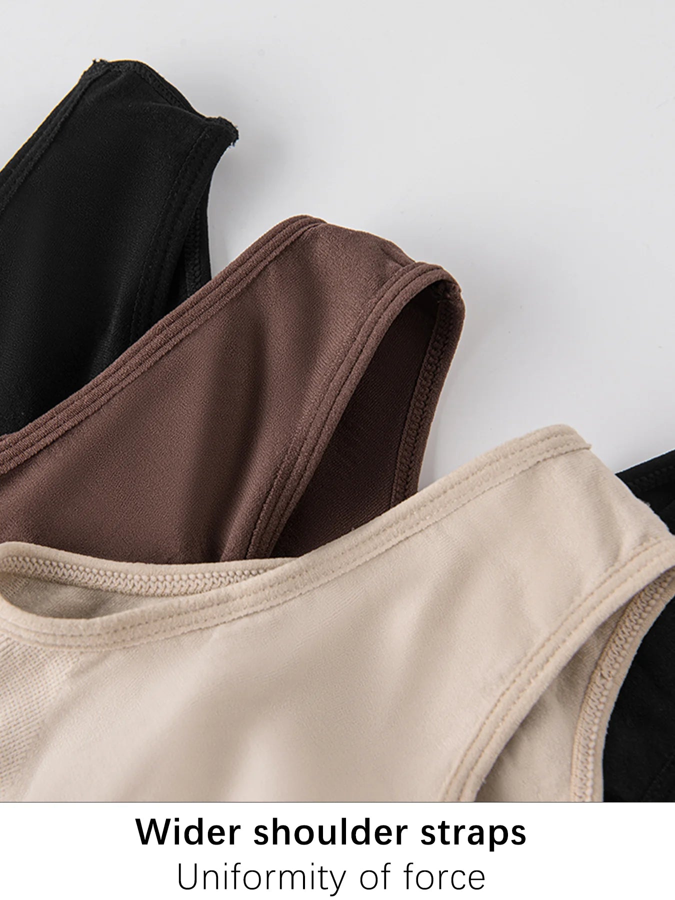 Close-up of wider shoulder straps on a white background